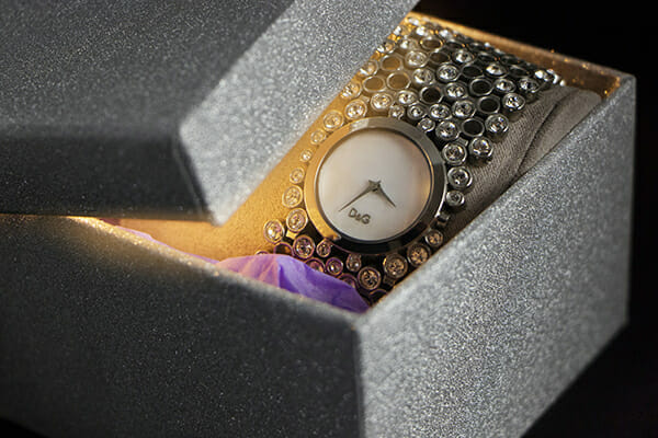 A still-life photograph of a watch in a presentation box &mdash; from the iPhotography Home Projects Course.