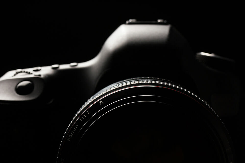 Low Light Photography Tips Low Key Image of DSLR Top Section