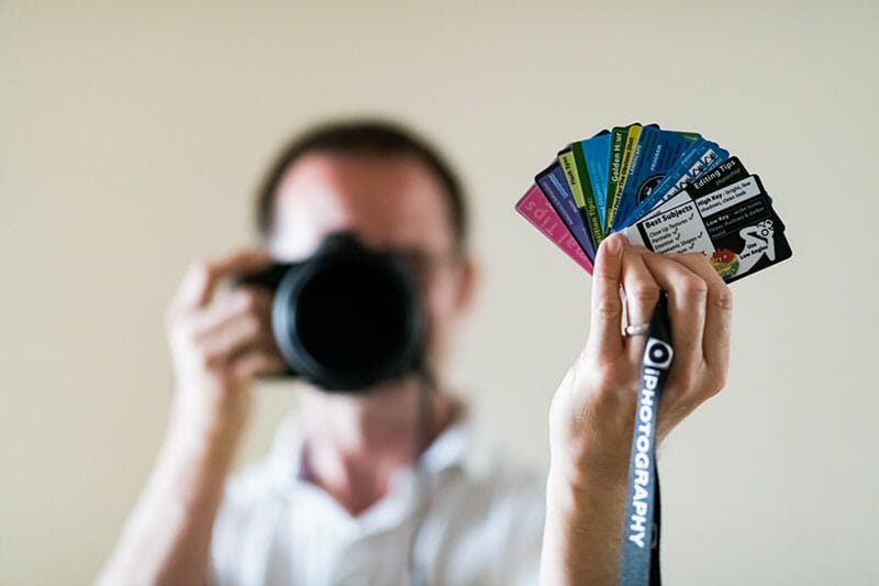 iPhotography member holding their Flip Cards on a shoot.