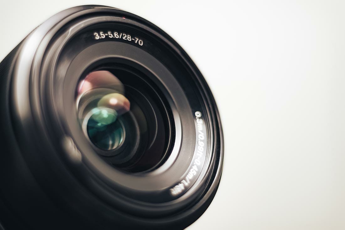 Close up beautiful camera lens on a gray background.