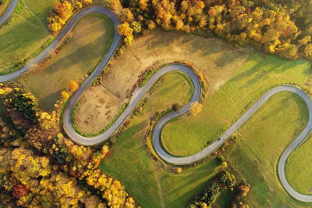 Road in autumn scenery - aerial shot