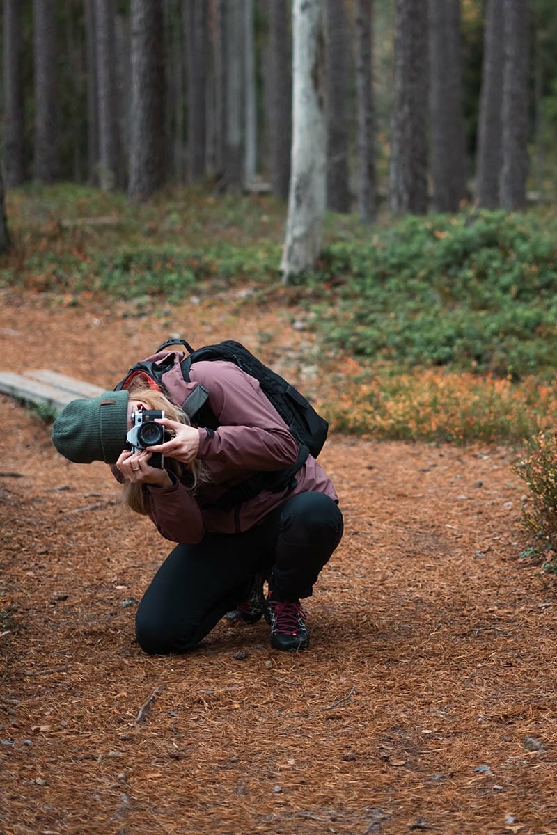 Expert,Nature,Photographer,Crouched,Down,And,Takes,A,Photo.,Blonde