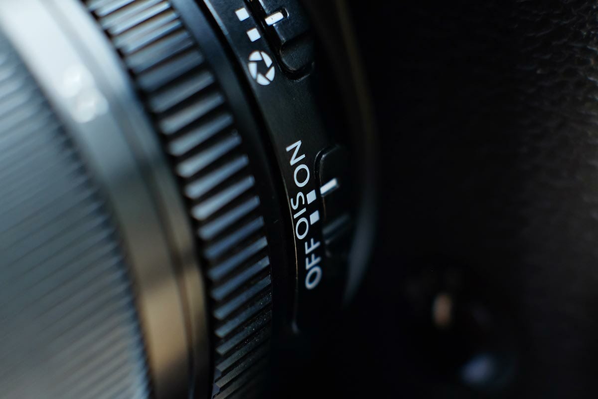 Mirrorless camera lens stabilization switch details