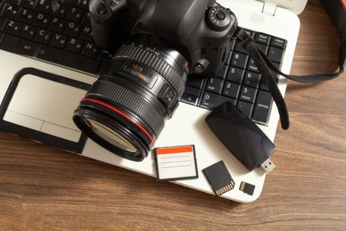 Modern DSLR camera and laptop computer.